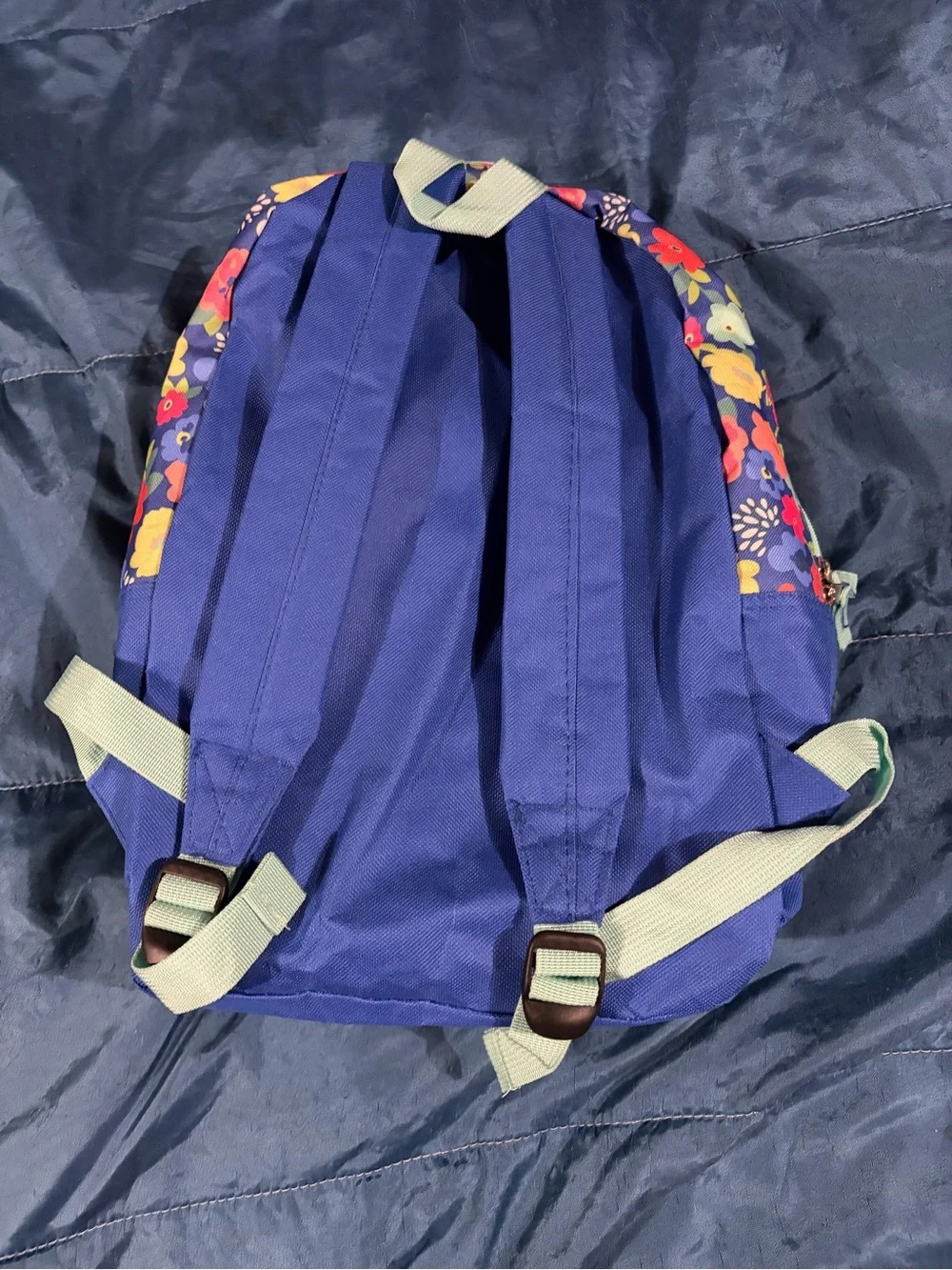 Navy backpack with vibrant flower print